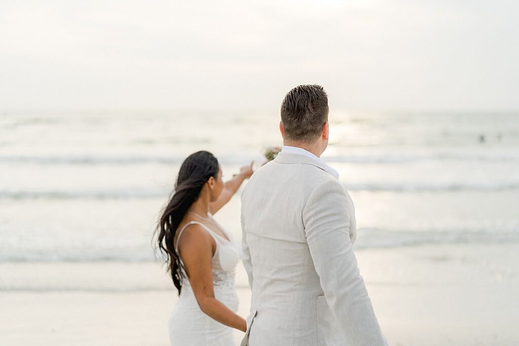 couple watching the sunset at Bellwether Beach Resort Wedding