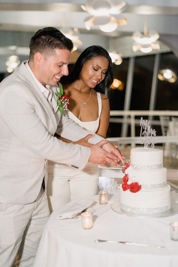 couple cutting wedding cake