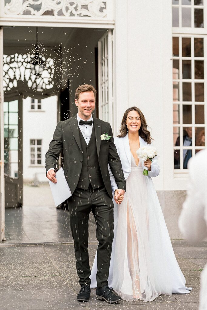 bride and groom at  Belgium Wedding exit 