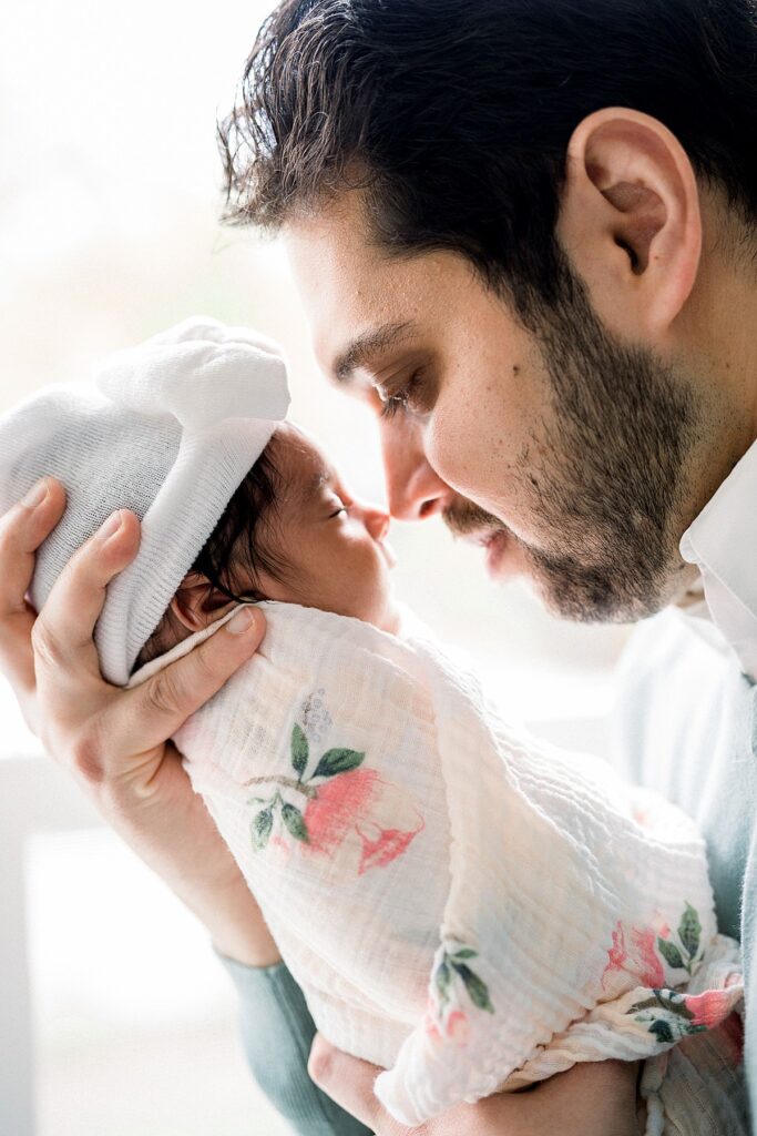 dad holding baby In-Home Newborn Session