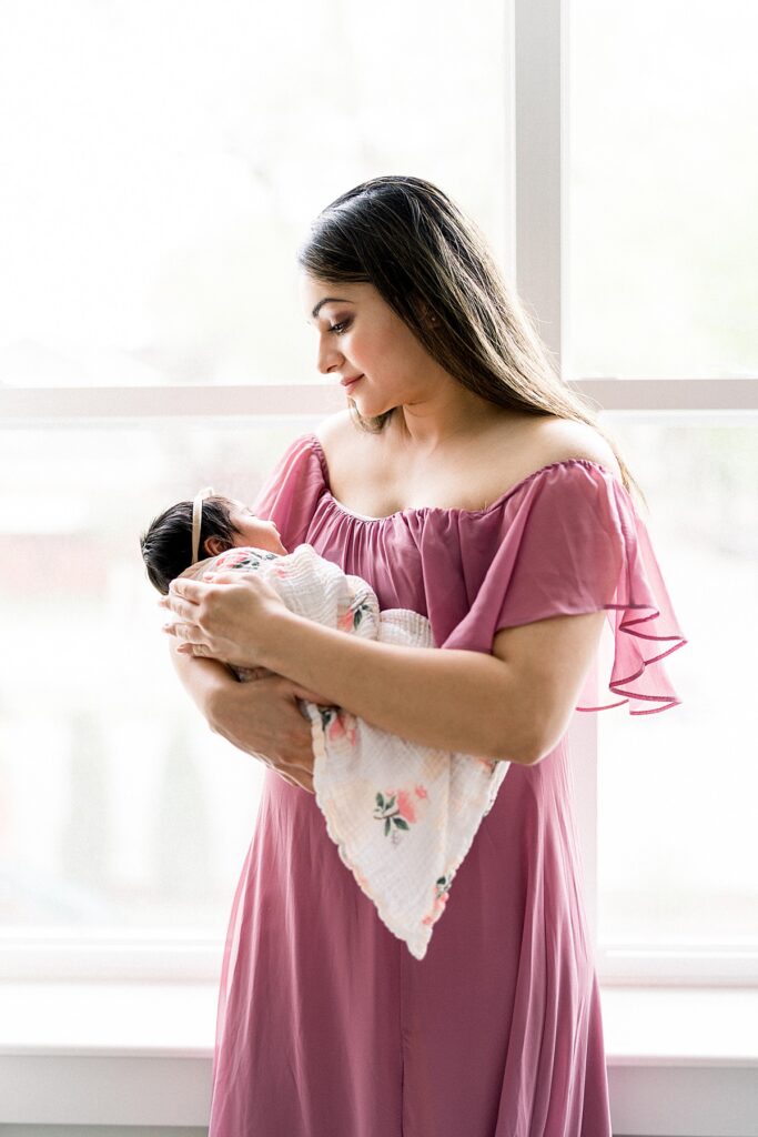 In-Home Newborn Session mom holding baby 